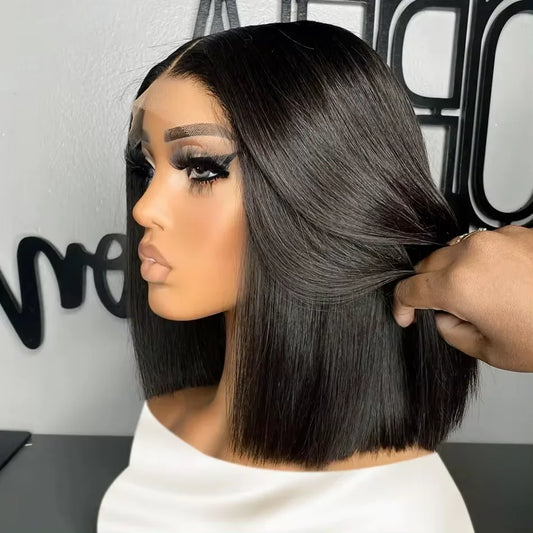 Person with a styled haircut being adjusted by another person, with a blurred background.