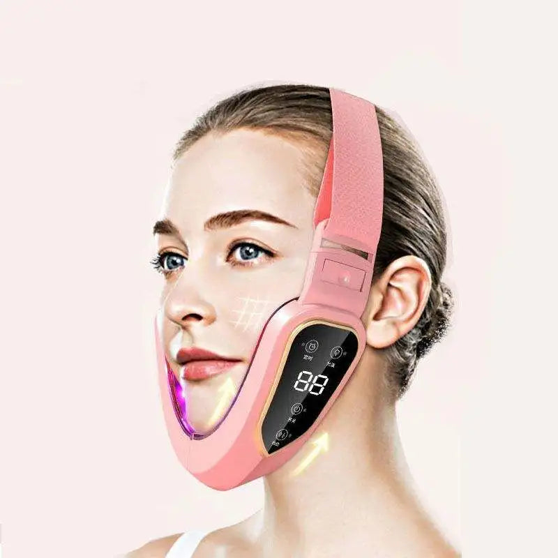 Woman wearing a pink facial lifting device with a digital display on a white background